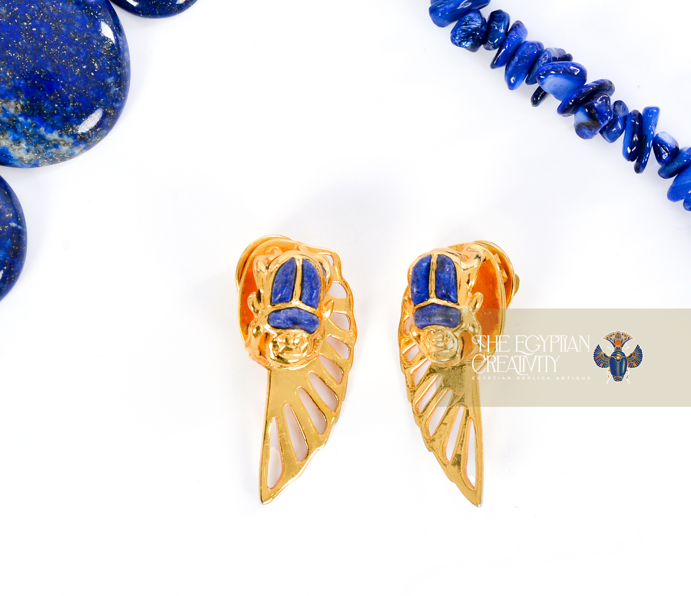The earrings of gold winged scarab